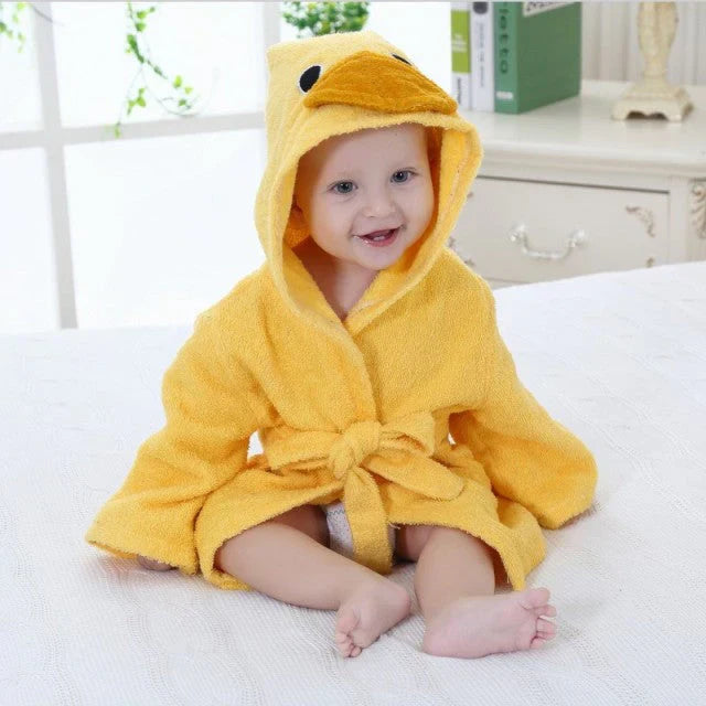 Peignoir animalier pour bébé, coton doux, posé sur lit