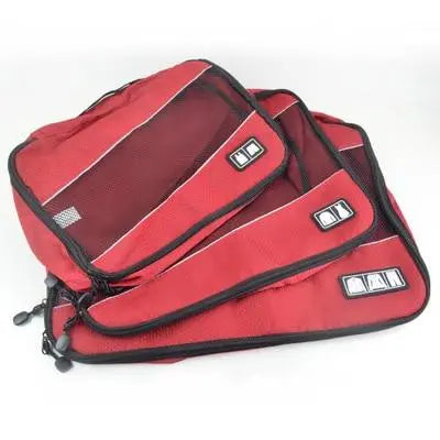 Trois pochettes rouges en nylon pour organiser une valise