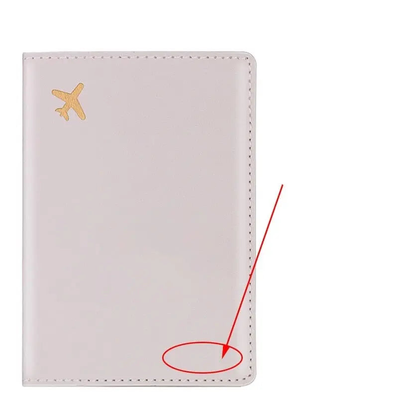 Étui gris pour passeport, avion doré, design moderne