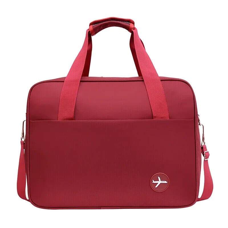 Sac de voyage rouge avec sangle pour valise