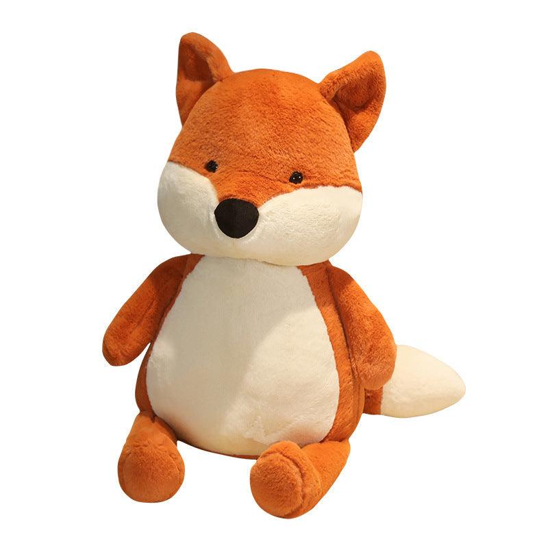 Peluche renard rouge classique posée sur une surface blanche