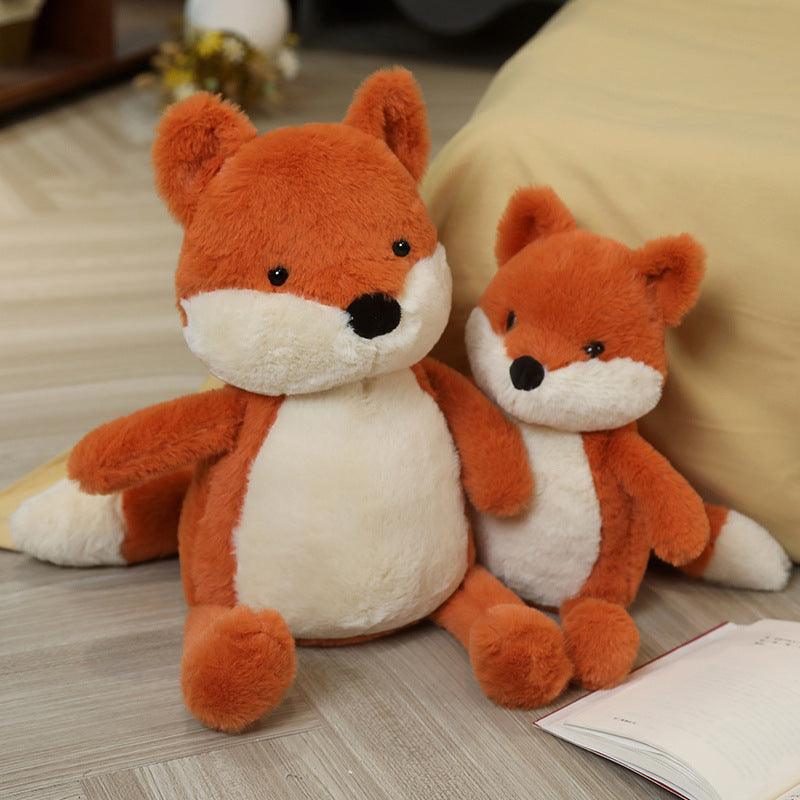 Renard en peluche rouge, vue de profil, montrant sa queue touffue