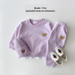 Vue de côté d'un ensemble enfant avec pantalon élastique