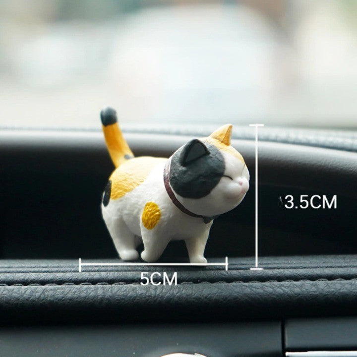Gros plan sur une tête de chat rotative en résine