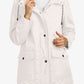 Veste imperméable femme avec capuche réglable et détails réfléchissants
