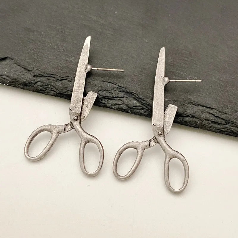 Vue d'ensemble des boucles d'oreilles ciseaux avec ombre