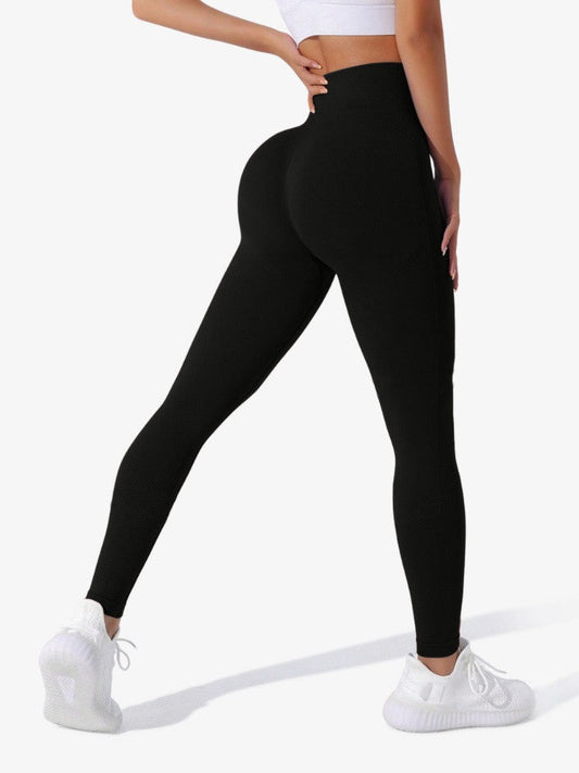 Vue latérale des leggings noirs, montrant la coupe sculptante