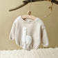 Combinaison bébé beige avec lamas colorés en motif