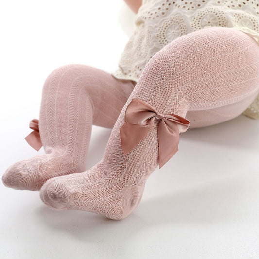 Collants mignons pour bébé avec nœud, détail matière douce