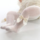 Collants bébé avec nœud, vue de côté, couleur rose