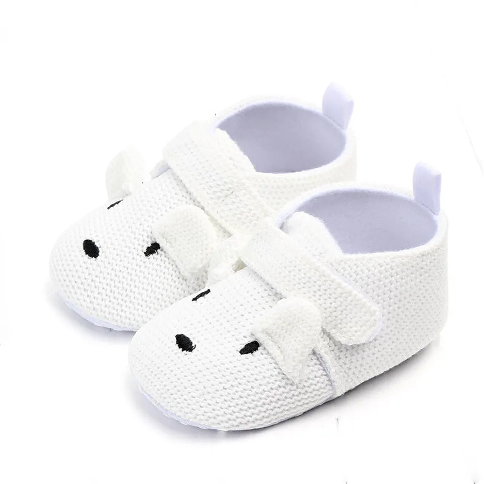 Vue de profil des chaussons bébé avec semelles antidérapantes