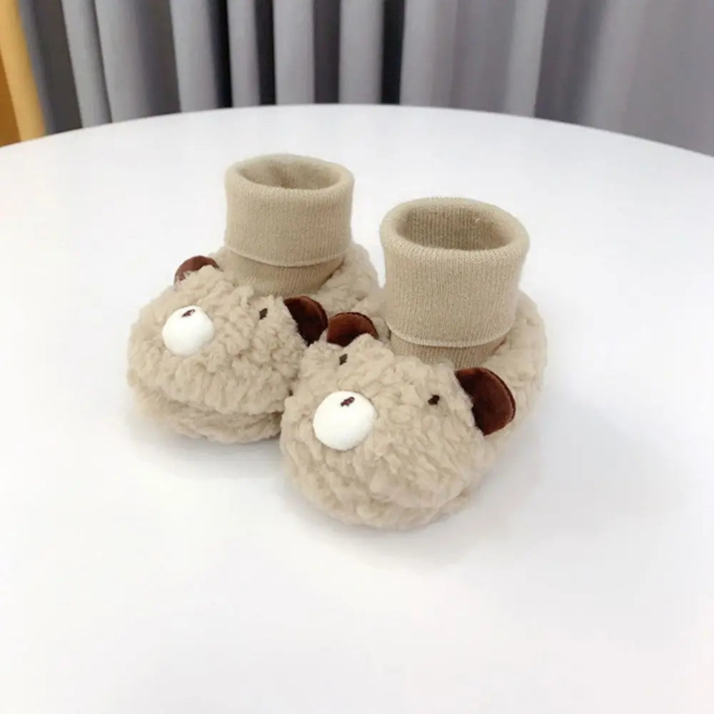 Détail des semelles antidérapantes des chaussons bébé