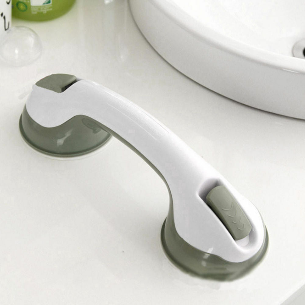 Barre de maintien avec ventouses sur carrelage blanc
