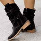 Bottines en suède marron, montrant la semelle et le talon