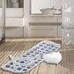 Tapis de bain avec bulles et télécommande sur le côté