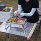 Barbecue pliable en acier inoxydable sur fond de nature