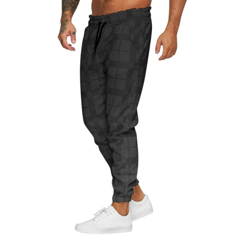 Pantalon à carreaux sur fond neutre, mise en scène