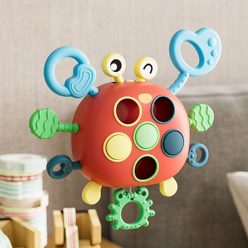 Jouet crabe en silicone avec cordons à tirer colorés