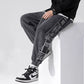 Pantalon en velours côtelé avec imprimé latéral moderne