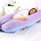 Coussin ergonomique en coton bio sur un lit blanc