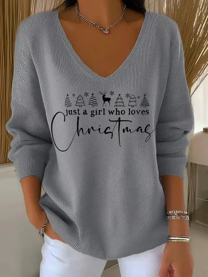 Femme portant un pull de Noël doux avec col montant