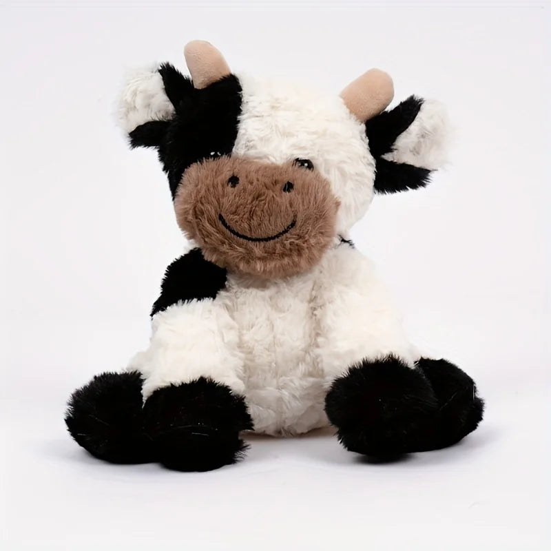 Peluche vache entourée de jouets, scène de jeu