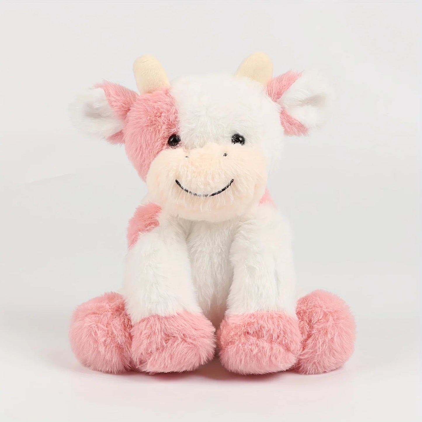 Peluche vache allongée, détails des pattes et du ventre