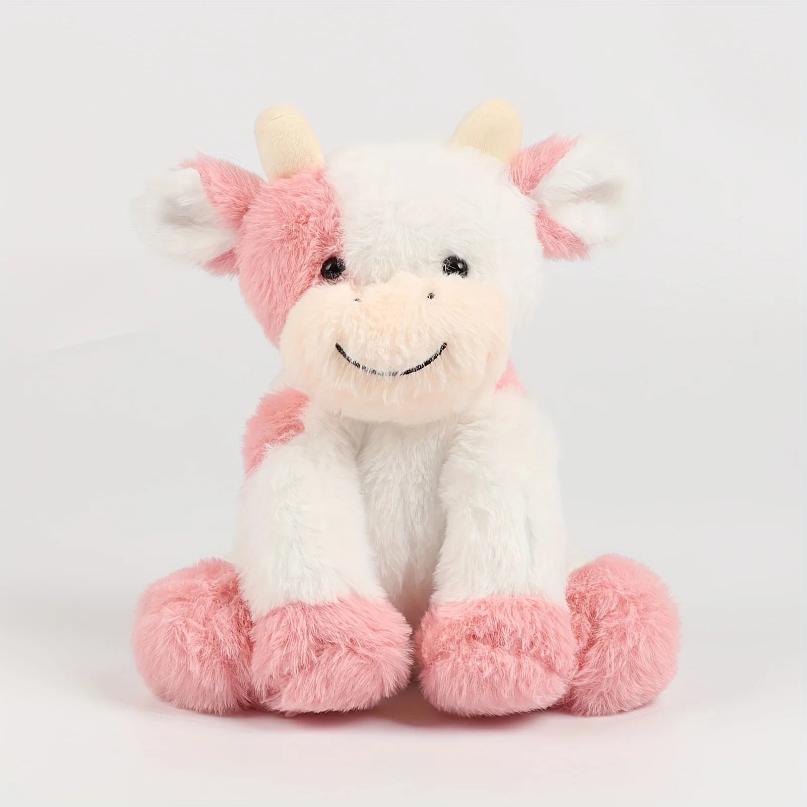 Peluche vache allongée, détails des pattes et du ventre