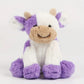 Gros plan sur les motifs tachetés de la peluche vache