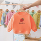 Texture du tissu en coton du pull fraise