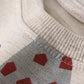 Vue de profil d'un pull en coton avec motif moderne