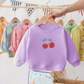 Pull cerise avec manches longues, posé à plat
