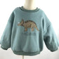 Détail des manches d'un pull imprimé en coton