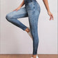 Jeggings noirs taille haute sur fond blanc