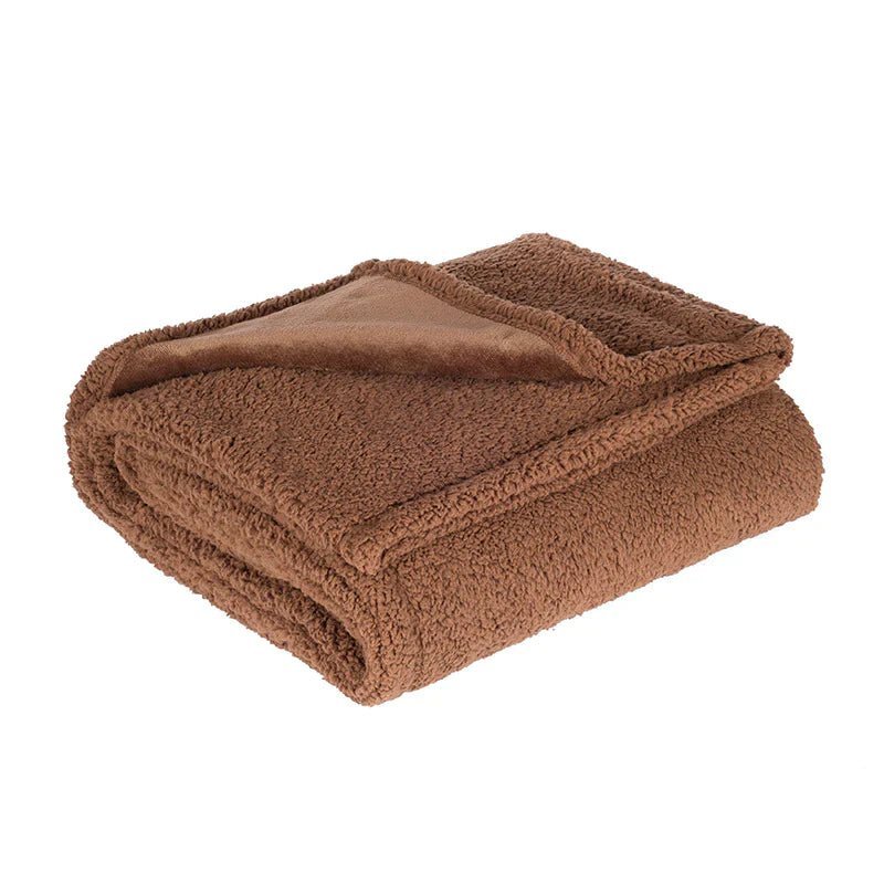 Couverture imperméable pliée montrant sa doublure protectrice