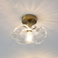 Lampe en verre et laiton vue de profil