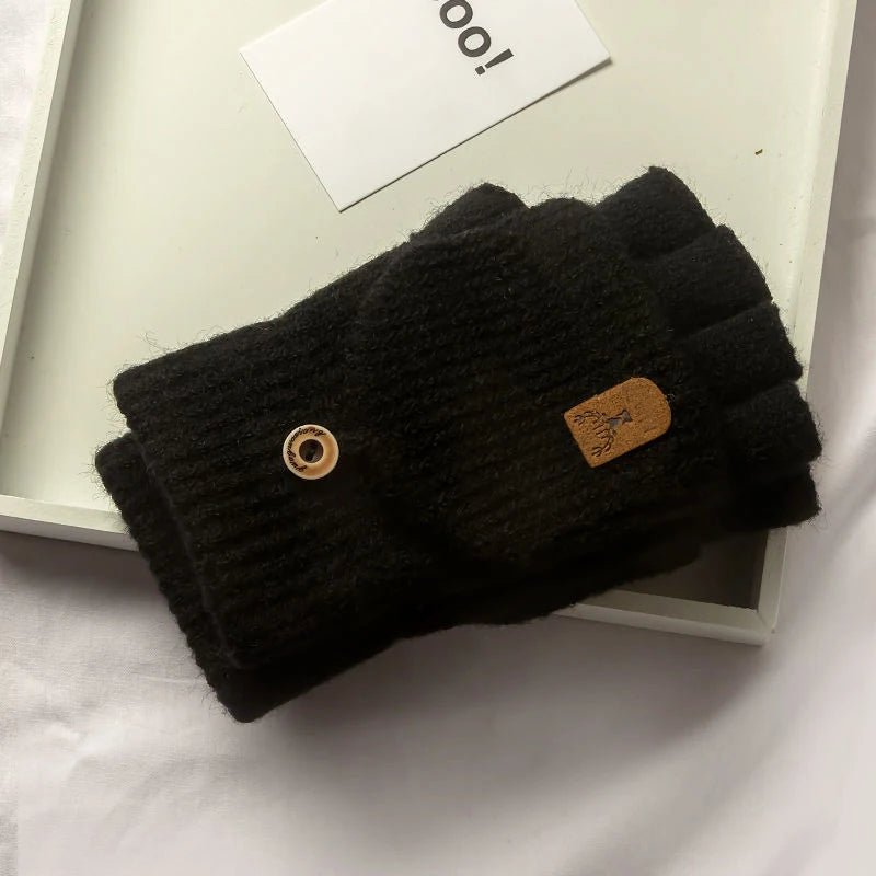 Gants mi-doigts en tricot marron posés à plat