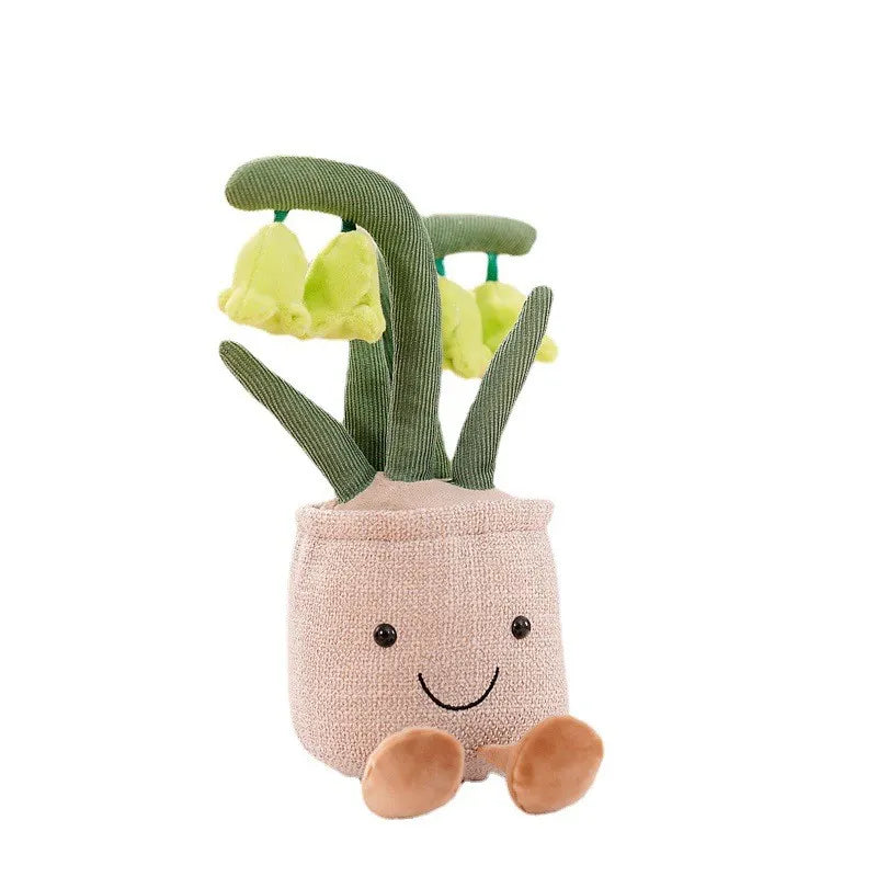 Tulipe en peluche avec un sourire, posée sur une table