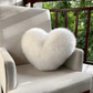 Coussin en forme de cœur dans un coin cosy