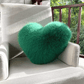 Texture douce du coussin cœur sur fond neutre