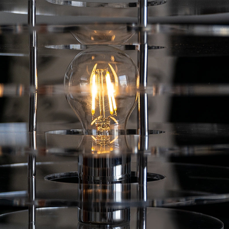 Vue de dessus de la lampe, soulignant sa forme circulaire