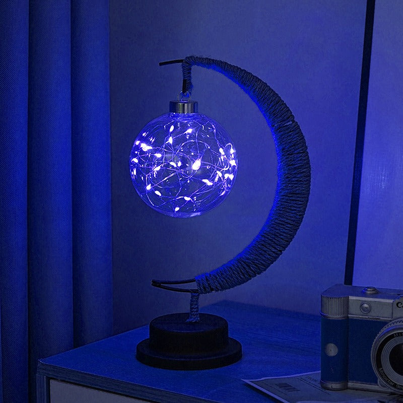 Lampe lunaire en verre, détail du socle et interrupteur