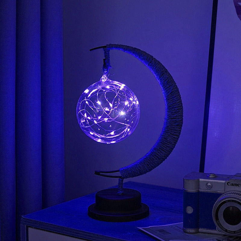 Lampe lunaire en verre vue de dessus, lumière douce