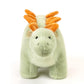 Gros plan sur le visage amical du dinosaure en peluche