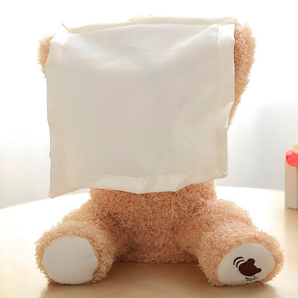Vue latérale de l'ours en peluche avec ses bras ouverts
