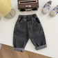 Jeans enfant noir, coupe décontractée, vue latérale