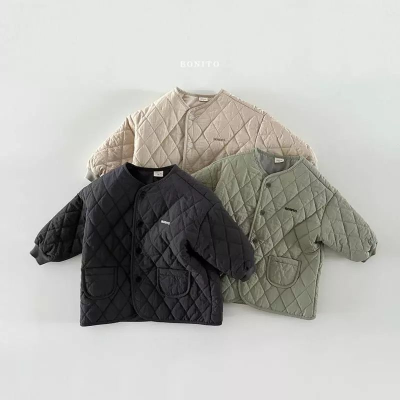 Veste matelassée beige pour enfant avec boutons-pression