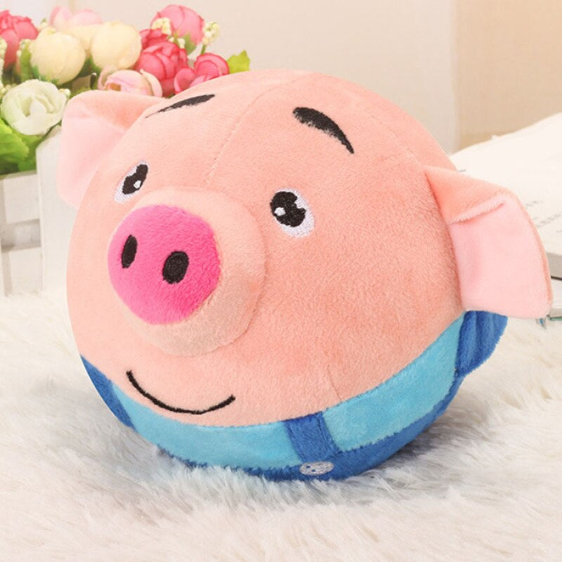 Cochon interactif en peluche posé sur une table