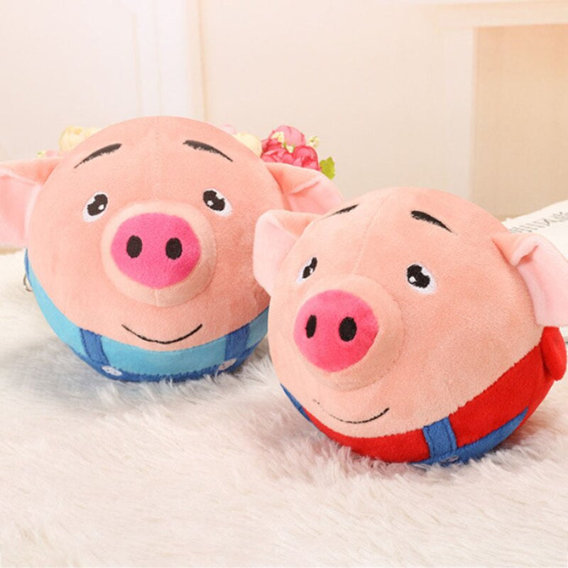 Cochon interactif en peluche sautant sur un tapis