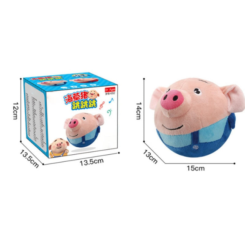 Enfant jouant avec le cochon interactif sur le sol